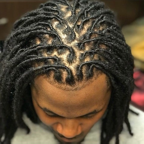 How to Retwist Dreads at Home in 2023, According to Locticians